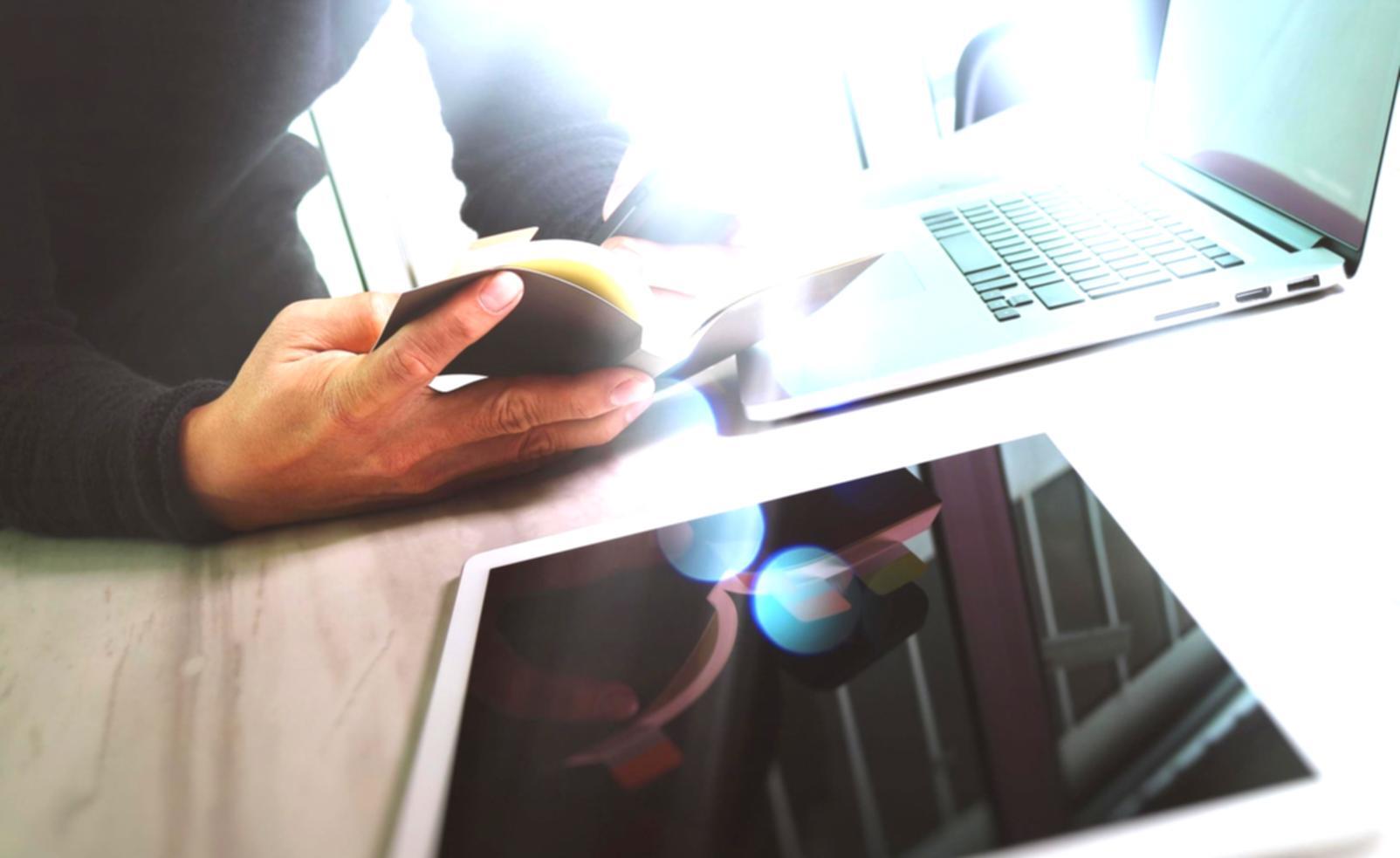 Metaverse development workspace showing multiple monitors with 3D environment design tools and AI training interfaces